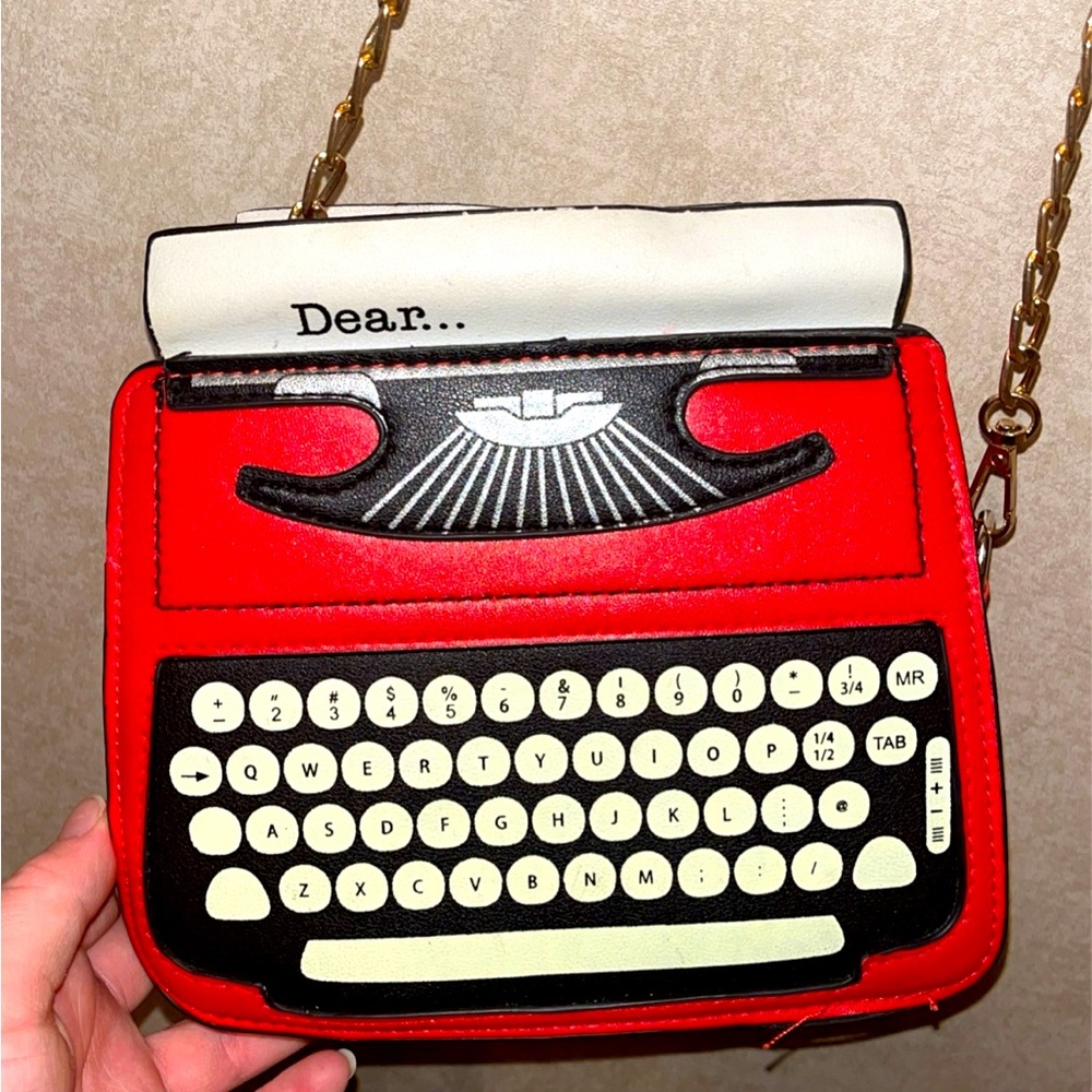 Typewriter purse roughly eight inches long by seven inches tall very spacious